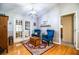 Charming sitting area with two blue velvet armchairs and French doors at 310 Willow Oak Ct, Fort Meade, FL 33841