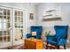 Relaxing sitting area with two blue armchairs and a wooden coffee table at 310 Willow Oak Ct, Fort Meade, FL 33841