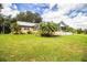 House with a screened patio, above ground pool, and expansive lawn at 310 Willow Oak Ct, Fort Meade, FL 33841