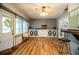 Sunroom with hardwood floors, built-in storage, and French doors at 310 Willow Oak Ct, Fort Meade, FL 33841
