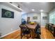 Long wooden dining table with black chairs in a bright dining room at 310 Willow Oak Ct, Fort Meade, FL 33841