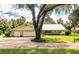 House with two car garage and large oak tree at 310 Willow Oak Ct, Fort Meade, FL 33841