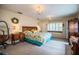 Main bedroom with king-size bed, window seat, and plenty of closet space at 310 Willow Oak Ct, Fort Meade, FL 33841