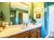 Bathroom with single vanity and mountain decor at 310 Willow Oak Ct, Fort Meade, FL 33841