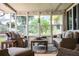 Screened porch with wicker furniture and a view of the backyard at 310 Willow Oak Ct, Fort Meade, FL 33841