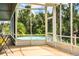 Screened porch with a view of the pool and surrounding nature at 310 Willow Oak Ct, Fort Meade, FL 33841