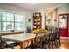 Farmhouse-style dining room with a large wooden table and black chairs at 310 Willow Oak Ct, Fort Meade, FL 33841