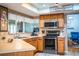 Bright kitchen featuring stainless steel appliances and ample counter space at 310 Willow Oak Ct, Fort Meade, FL 33841