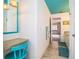 Vanity area with teal chair and mirror at 310 Willow Oak Ct, Fort Meade, FL 33841