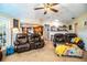 Living Room with brown reclining sofas and an ottoman at 310 Willow Oak Ct, Fort Meade, FL 33841