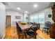 Spacious dining area with a large wooden table and black chairs at 310 Willow Oak Ct, Fort Meade, FL 33841