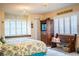 Main bedroom with a king bed and access to the bathroom at 310 Willow Oak Ct, Fort Meade, FL 33841