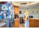 Kitchen with stainless steel refrigerator and wood cabinets at 310 Willow Oak Ct, Fort Meade, FL 33841