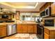 Kitchen with stainless steel appliances and wood cabinets at 310 Willow Oak Ct, Fort Meade, FL 33841