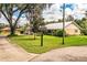 Single story home with metal roof and landscaped yard at 310 Willow Oak Ct, Fort Meade, FL 33841