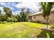 House with a screened patio, and expansive lawn at 310 Willow Oak Ct, Fort Meade, FL 33841