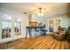 Sunroom with hardwood floors, breakfast bar, and comfy seating at 310 Willow Oak Ct, Fort Meade, FL 33841