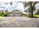 Three-car garage with ample parking space at 310 Willow Oak Ct, Fort Meade, FL 33841