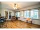Sunroom boasts hardwood floors, French doors, and a Coca-Cola cooler at 310 Willow Oak Ct, Fort Meade, FL 33841