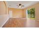Bright living room with wood floors and sliding glass doors leading to backyard at 2948 Vintage View Cir, Lakeland, FL 33812