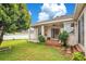 House exterior and backyard view with patio, landscaping, and fence at 2948 Vintage View Cir, Lakeland, FL 33812