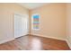 Spacious bedroom with wood flooring, double door closet and a window at 2948 Vintage View Cir, Lakeland, FL 33812