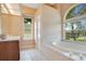 Bathroom with a soaking tub and double vanity at 2948 Vintage View Cir, Lakeland, FL 33812