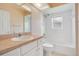 Clean bathroom with tub, toilet, and vanity with a single sink at 2948 Vintage View Cir, Lakeland, FL 33812