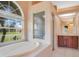 Bathroom boasts a large garden tub, shower, and updated vanity at 2948 Vintage View Cir, Lakeland, FL 33812