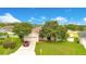 House with driveway, two-car garage, and nicely landscaped lawn at 2948 Vintage View Cir, Lakeland, FL 33812