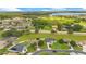 Aerial view showcasing a house with a lake view in a residential neighborhood at 2948 Vintage View Cir, Lakeland, FL 33812