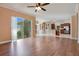 Open living room with hardwood floors and access to the kitchen and backyard at 2948 Vintage View Cir, Lakeland, FL 33812