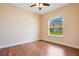 Bright bedroom with wood flooring and a window overlooking the backyard at 2948 Vintage View Cir, Lakeland, FL 33812