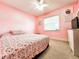 Charming bedroom with floral bedding and unicorn wall decor at 2036 E Gachet Blvd, Lakeland, FL 33813