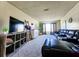 Relaxing living room featuring plush leather seating and ample natural light at 2036 E Gachet Blvd, Lakeland, FL 33813