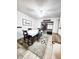 Dining room with table, chairs, and view into the living room at 2036 E Gachet Blvd, Lakeland, FL 33813