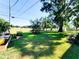 Large backyard with garden and mature trees at 2036 E Gachet Blvd, Lakeland, FL 33813