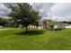 Single-story house with large grassy yard at 1619 Prairie Blossom Dr, Lakeland, FL 33810