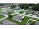 Aerial view showcasing a quiet residential neighborhood with homes and landscaping at 1619 Prairie Blossom Dr, Lakeland, FL 33810