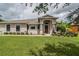 Single-story home with landscaped yard at 1619 Prairie Blossom Dr, Lakeland, FL 33810