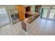 Kitchen with an island and access to backyard at 2584 Edmond Cir, Auburndale, FL 33823