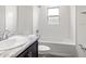 Clean bathroom with tub and dark brown vanity at 568 Sw 77Th Cir, Ocala, FL 34480