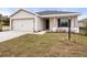 New construction home with attached garage and landscaped lawn at 568 Sw 77Th Cir, Ocala, FL 34480