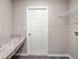 Laundry room with built-in shelving and countertop at 568 Sw 77Th Cir, Ocala, FL 34480