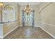 Elegant dining room features a chandelier and tile floors at 6414 Highlands In The Woods St, Lakeland, FL 33813