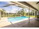 Screened pool and patio area with lake view at 5811 Trophy Loop, Lakeland, FL 33811