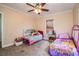 Spacious bedroom with two twin beds and plenty of room for toys at 422 E Belmar St, Lakeland, FL 33803