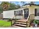 Steps leading to the front entrance of a manufactured home at 4779 W Myrtle View Dr, Mulberry, FL 33860