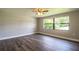 Bright bedroom with wood-look floors and a ceiling fan at 415 Lucille St, Bartow, FL 33830