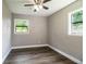 Well-lit bedroom with two windows and wood-look flooring at 415 Lucille St, Bartow, FL 33830